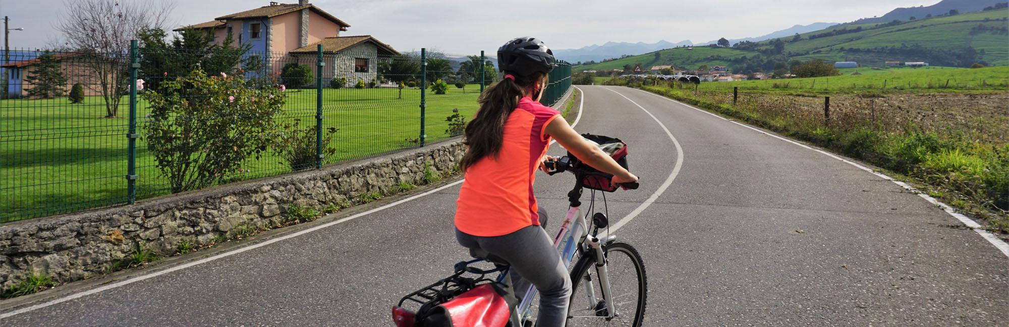Cyclist biking in an Asturian road
