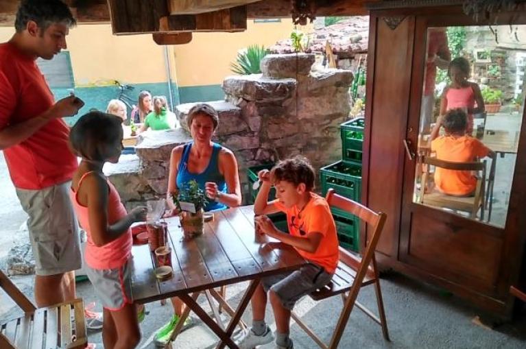 Family eating under a Horreo
